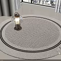 Light Gray Round Rug with Herringbone Pattern Black White Trim and Lantern Shaped Object 3d model