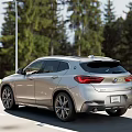 Stylish Silver BMW SUV Exterior Design On Road With Grass Side