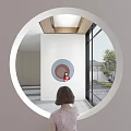 Woman Viewing Mirror In Circular Structure Of Modern Sales Office With White And Pink Walls