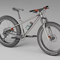 Gray Frame Fat Tire Mountain Bike With Red Handlebars And Water Bottle Cage