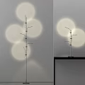 Modern Minimalist Floor Lamp With Circular Light Projections And Sleek Metal Stand Design