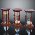 Three Wooden Hourglasses With Sand On Black Surface And Clear Reflections