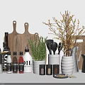 Assorted Spice Bottles with Wooden Cutting Boards Fresh Herbs Kitchen Utensils and Decorative Branches
