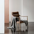 Brown Leather Leisure Chair With Wooden Armrests And Gray Blanket In Modern Interior