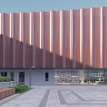 Modern Office Building With Ribbed Red Metal Exterior Glass Front And Paved Square
