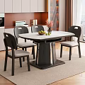 Modern Dining Room with Marble Tabletop Six Black Chairs Flower Vase and Bowl of Fruits