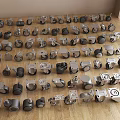 Various Casters And Wheels Scattered On Wooden Floor With Different Styles