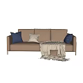 Two Seater Sofa With Beige Upholstery Blue Brown Pillows And Soft Blanket