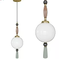 Pendant Lights In Two Sizes With White Spherical Shades Brass Base And Decorative Tassel