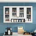White Glass Door Cabinet On Blue Tiled Wall With Jars Mugs And Kitchen Utensils