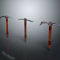 Three Vintage Pickaxes with Wooden Handles Metal Heads and Red Accents