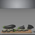 Whole and Halved Eggplants with Sliced Rounds on Wooden Cutting Board and Knife