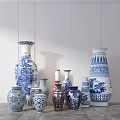Blue And White Ceramic Vases With Traditional Patterns Displayed On Gray Marble Countertop