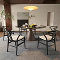Modern Dining Room Interior With Round Table Black Chairs Beige Cushions And Ceiling Lamp