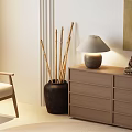 Modern Chest of Drawers with Bamboo Sticks in Clay Pot Table Lamp and Buddha Statue