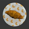 Golden Croissant On White Plate With Orange Croissant Patterns
