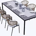 Garden Landscape Outdoor Dining Setup With Rattan Chairs Tableware And Water Glasses