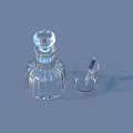 Transparent Glass Lidded Bottle and Small Cup with Reed Sticks as Daily Household Items