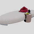 Beige Oval Single Sofa With Small Side Table Red Towel Black Decor And Green Item
