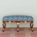 Elegant Sofa Bench With Blue Floral Upholstery And Wooden Legs With Gold Accents
