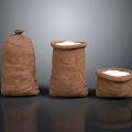 Three Different Sizes Burlap Storage Sacks Filled With White Granular Substance For Household Use