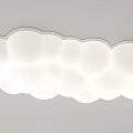 Cloud shaped white ceiling light with multiple circular elements and soft glow design