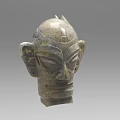 Ancient Bronze Mask With Intricate Facial Features And Carved Details