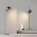 Modern Floor Lamp Design Illuminating Wall With White Vase And Books On Table 3d model