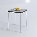 Simple Modern Coffee Table With Gray Top White Metal Legs And Plate Of Lemons On Surface