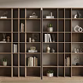 Wooden Bookcase With Open Cube Shelves Featuring Books Decorative Items and Potted Plants