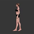 Woman in Black Sports Bra and Black Shorts Standing Barefoot on Dark Background