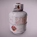 Silver Gray LPG Cylinder With Red Valve And Warning Label On Metal Surface