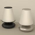 Two Modern Table Lamps With Black And Silver Bases And White Shades