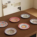 Six Decorative Vibrant Colorful Patterned Plates Arranged On Wooden Tabletop