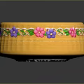 Yellow Decorative Bowl With Colorful Floral Patterns And Green Leaves On Edge