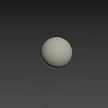 Circular Spherical Component On Light Colored Surface With Beige Rough Textured Wall