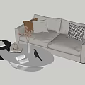 Gray Sofa and White Oval Coffee Table Set with Decorative Pillows Dried Flowers and Open Book