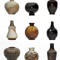 Ceramic Vessels In Various Shapes With Earth Tones Black White And Unique Patterns