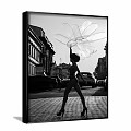 Black and White Figure Painting Featuring Female Holding Large Petal Shaped Sculpture in Urban Street Setting