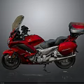 Sleek Red Cruiser Motorcycle With Windshield Black Seat And Rear Luggage Case