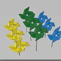 Colorful Yellow Blue Green Pinwheels With White Centers On Black Sticks Against Light Blue Background
