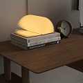 Decorative Ornament Set With Fan Shaped Lamp Alarm Clock And Books On Wooden Table