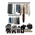 Clothes Hanging On A Rack With Various Styles Colors Bags Shoes And Scarves