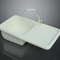 Modern White Kitchen Sink With Chrome Faucet And Grooved Draining Board