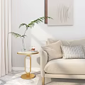 Elegant Round Side Table With Marble Top And Golden Frame By Beige Sofa With Pillow