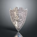 Silver Decorative Shield Featuring Ornate Carvings and Knight on Horseback Design