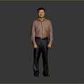 The Man Standing Against Gray Background In Pink Shirt Dark Pants And Black Shoes