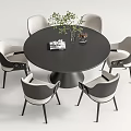 Round Black Dining Table Set with Six Gray White Chairs Green Plant Magazine and Vase