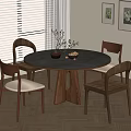 Modern Round Wooden Dining Table Set with Four Upholstered Chairs and Decorative Vases