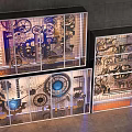 Industrial Style Commercial Equipment with Gear Mechanical Patterns and Illuminated Glass Display Cases